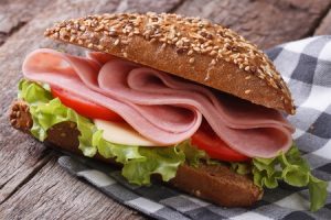 sandwich with ham, lettuce and tomatoes 